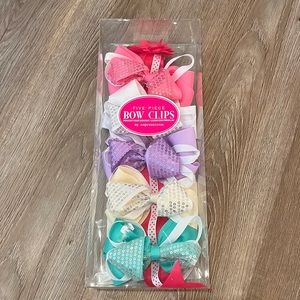 Five bows and holder